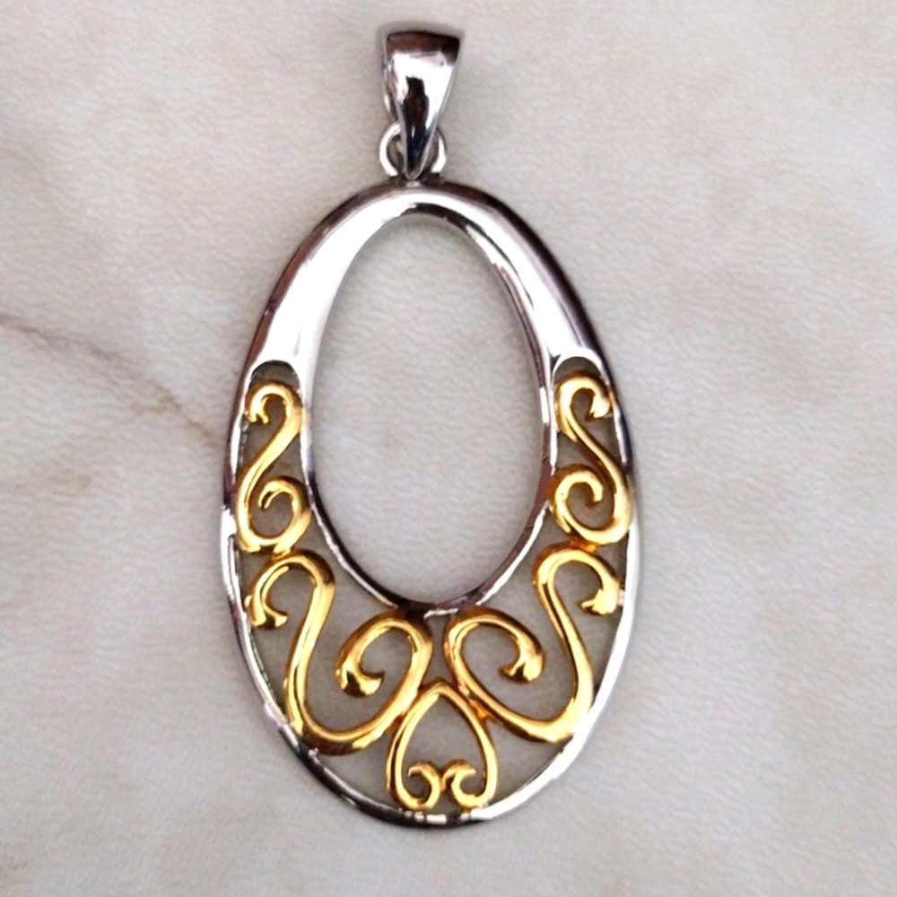 LS silver and gold pendant.